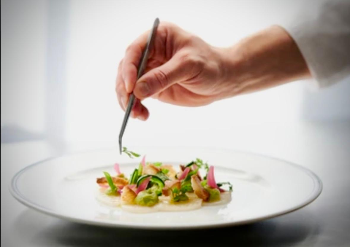 Executive chef preparing bespoke inflight catering at London Farnborough Airport EGLF